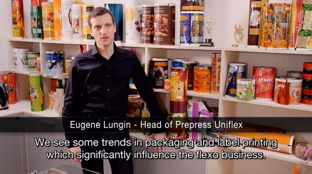 Image of Eugene Lungin, Head of Prepress at Uniflex standing in front of some of Uniflex's packaging